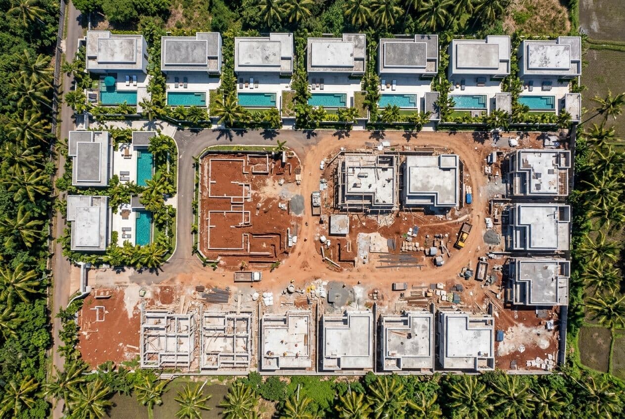 Aerial view of a tropical villa development under construction